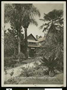 Exterior view of a Pasadena home and garden in January, ca.1900