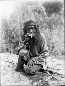 smoking indian tobacco Old Havasupai Indian man crouching on the ground, smoking a cigarette,  ca.1900 — Calisphere
