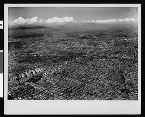 Aerial view of Los Angeles, looking northeast from the intersection of Fairfax and Wilshire Boulevard, 1952