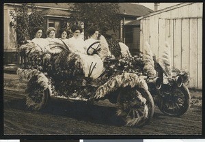 Postcard of a flower-decked car ready for a parade, ca.1915