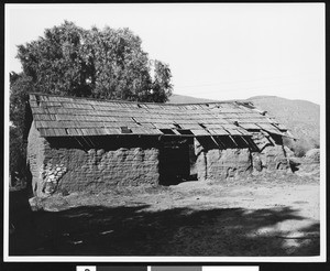 Rear view of a building of quadrangle at rear of cemetery, Pala Mission Asistencia, ca.1900