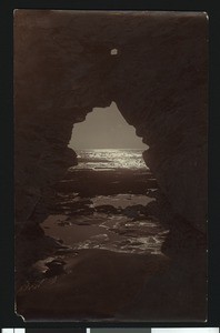 Nighttime view of the ocean as seen through a cave in La Jolla, ca.1900