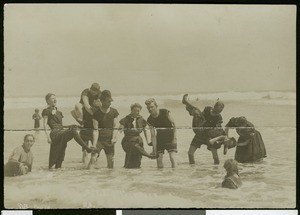 Group of bathers posing in the ocean in Long Beach, ca.1900