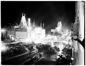 View of Hollywood Boulevard, showing Grauman's Chinese Theater illuminated for the movie premier of "Hell's Angels", ca.1929