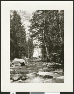 Unidentified river scene showing a small cascade through trees in the background, ca.1950