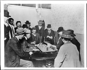 Interior view of a gambling hall showing a faro game, ca.1900