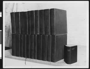 Bible in Braille (21 volumes), with ink-print bible next to it, ca.1928