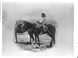 Navajo Indian boy on horseback, ca.1900