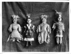 Four modern Sioux Indian dolls on display, ca.1900