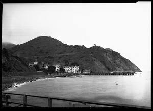 Shore of Catalina Island, shown froma nearby pier, 1927