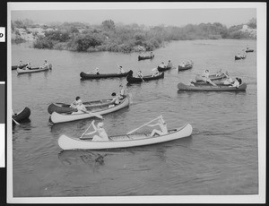 Group of canoers on a lake, ca.1940