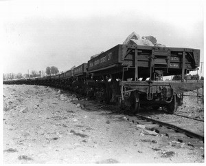 Loaded railroad cars at the Imperial Valley Canal, taken from the west side entrance, ca.1910