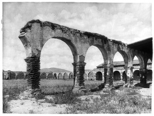 Mission San Juan Capistrano, showing the broken dilapidated arches from the southwest side, California, 1900