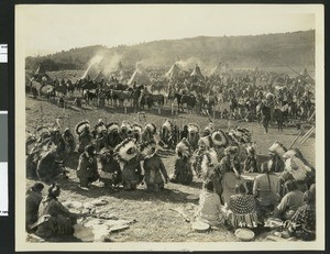 Movie production still of Indians in the film "The Big Trail", ca.1920