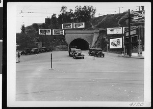 Billboards surrounding the north mouth of Broadway tunnel and a neon sign on the Villa Roma Café, Los Angeles, 1935