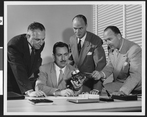 Four Lear Corporation Research and Development Division workers at work, September 1950