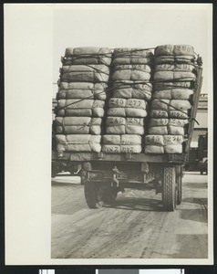 Packages on the back of a silk truck, ca.1925