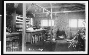 Interior view of Fern Lodge building showing a fireplace, ca.1930