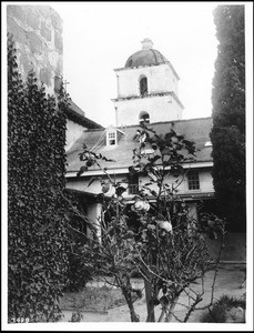 Mission Santa Barbara bell tower viewed from cloistered Sacred Garden, ca.1902