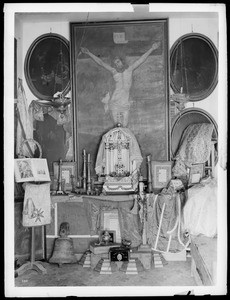 Interior of the Los Angeles Plaza Church showing relics, ca.1900