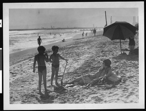 Woman and two children on Venice Beach, ca.1934