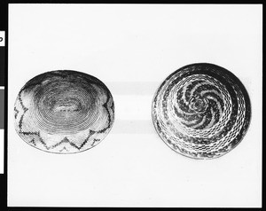 Two Indian baskets on display against a neutral background