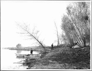 Small outboards landing to make camp on the shore of the Colorado River, ca.1900