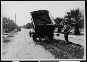 Dump truck leaving asphalt on an unpaved road in Los Angeles