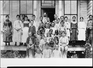 Students and teacher, Mr. Spencer, in front of San Fernando School on Mission Boulevard, ca.1887