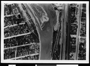 Aerial view of a flooding area, showing the river, 1938