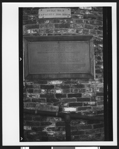 Commemorative plaque on an oil refinery in Newhall, ca.1875