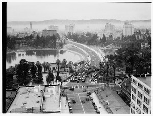 Birdseye view of a large crowd on the causeway across Westlake Park in Los Angeles