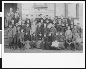 A group portrait of students and their teachers in front of University School, 1894