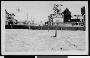 Woman walking along contruction on an unidentified street