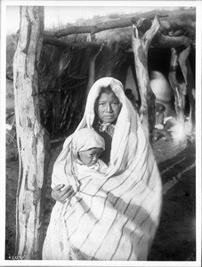 A Yaqui Indian mother holding a baby, Arizona, ca.1910