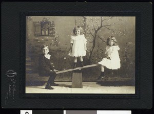 A portrait of children on a teeter-totter