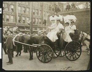 Float decorated with long grass at La Fiesta de Los Angeles parade, 1906