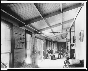 Portrait of Parker Dear and Elena Couts Dear on an enclosed porch at Guajome Ranch in San Diego, 1870-1880