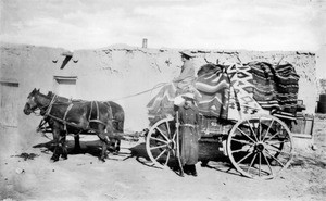 Two traders and their horse-drawn wagon, Arizona