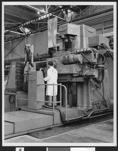 Interior of the Northrop Corporation's Plant, showing a 54-ton machine, part of the "U.S. Air Force's long range plans to obtain advanced weapons systems economically", ca.1950