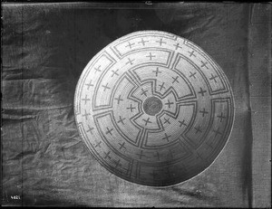 Indian basket displayed against a cloth backdrop, ca.1900