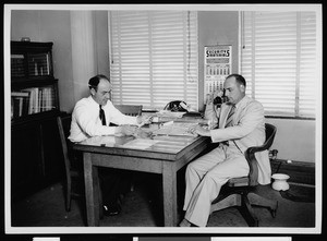 Two men at the Federal Coordinating Division of the Department of Public Works