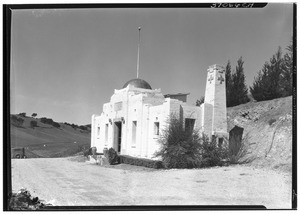 Exterior view of a white brick mausoleum at Los Angeles Pet Memorial Park, 1930-1950