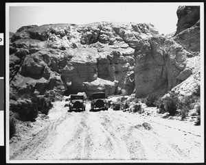 Two automobiles in Last Chance Canyon, Kern County, CA, ca.1905-1930