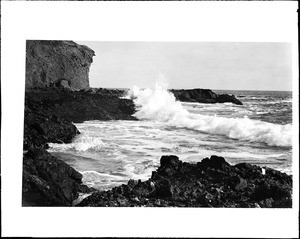 Laguna Beach surf breaking on rocks on Mussel Point, ca.1910