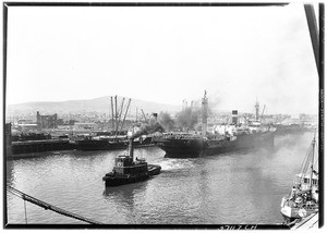 New York steam ship "Cuzco" being towed out of the Los Angeles Harbor channel, 1931