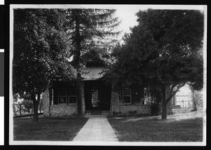 Exterior view of a brick house in San Bernardino, ca.1900