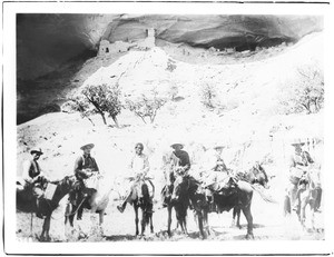 Six men on horseback near Mummy Cliff dwelling in Canyon del Muerto, ca.1895