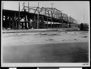 View of a wooden viaduct over a railroad yard in Los Angeles