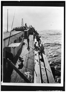 People fishing from a fishing barge, ca.1930